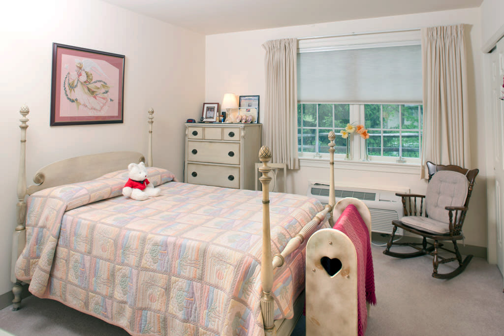 Cozy bedroom with twin bed and rocking chair